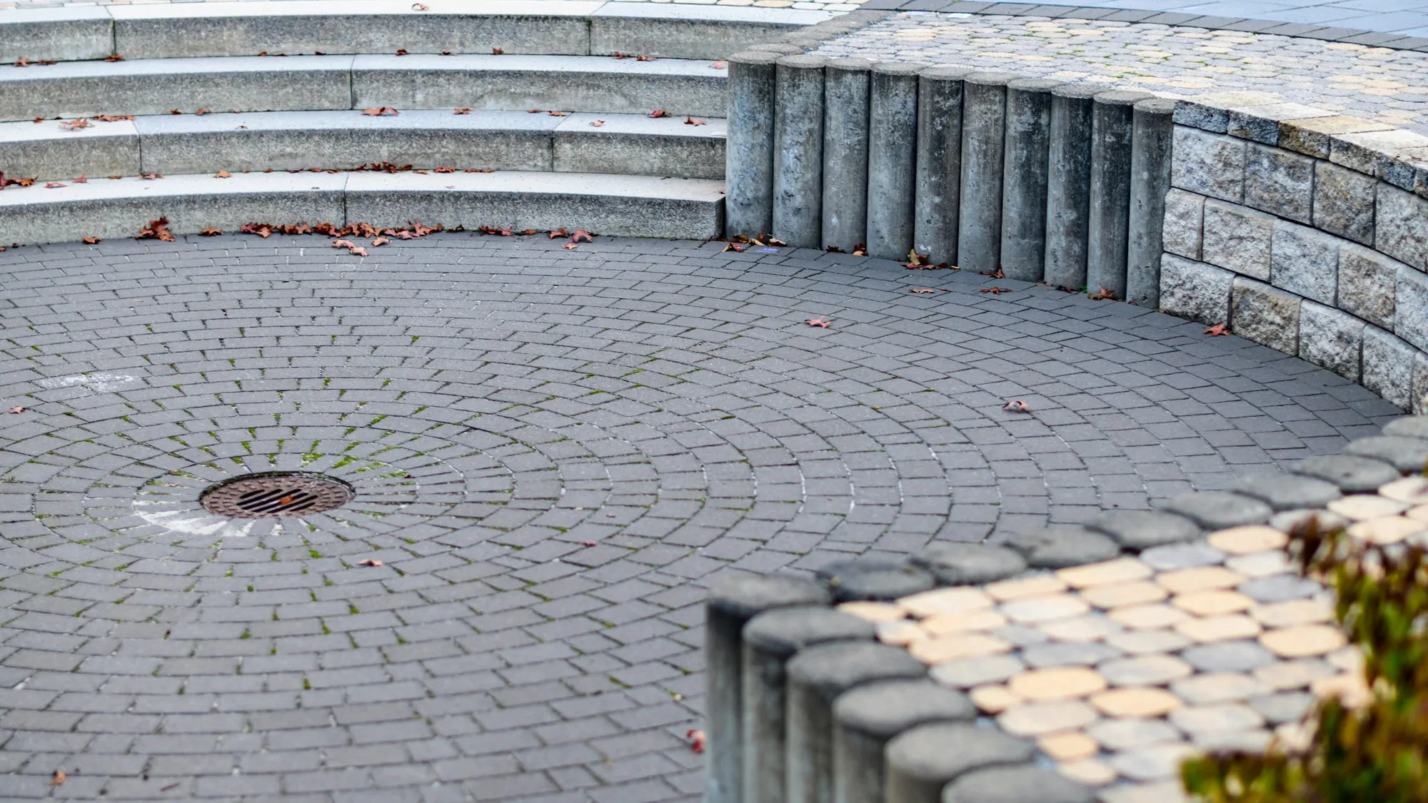 Circular paver courtyard with plantings