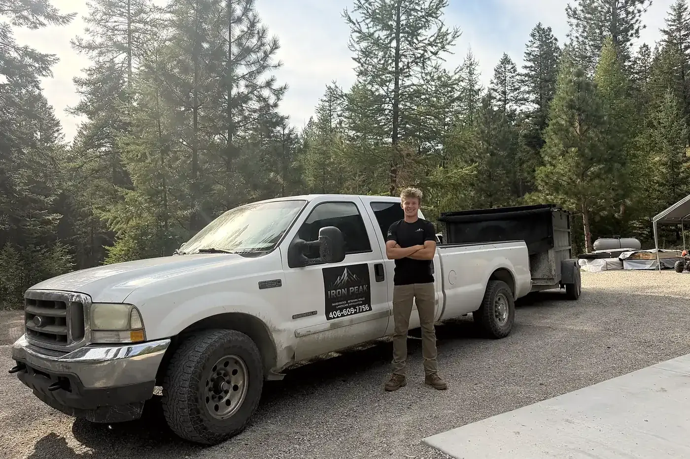 Iron Peak Landscaping truck and trailer on a Flathead Valley job site